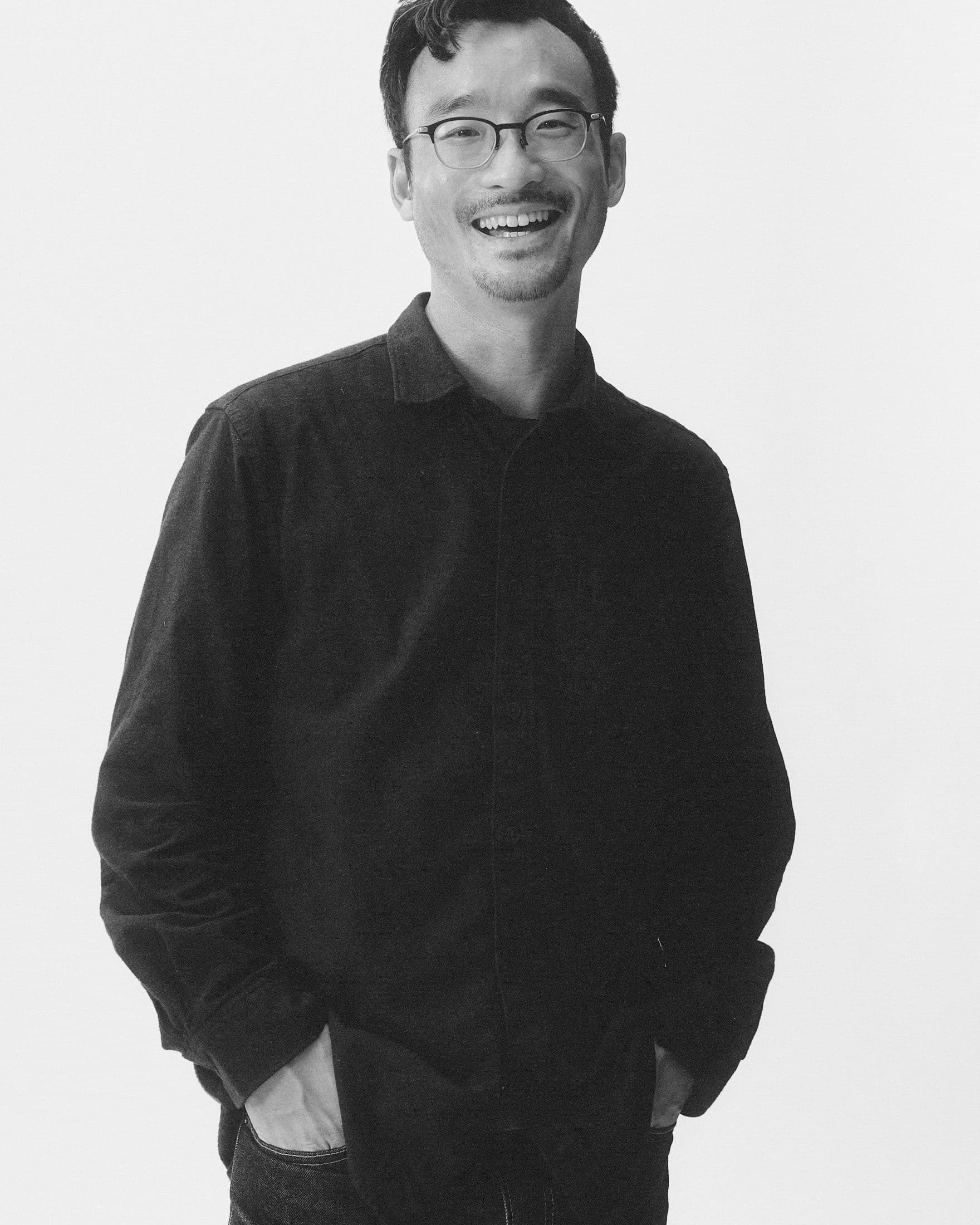 Victor Yuen standing against a light background.