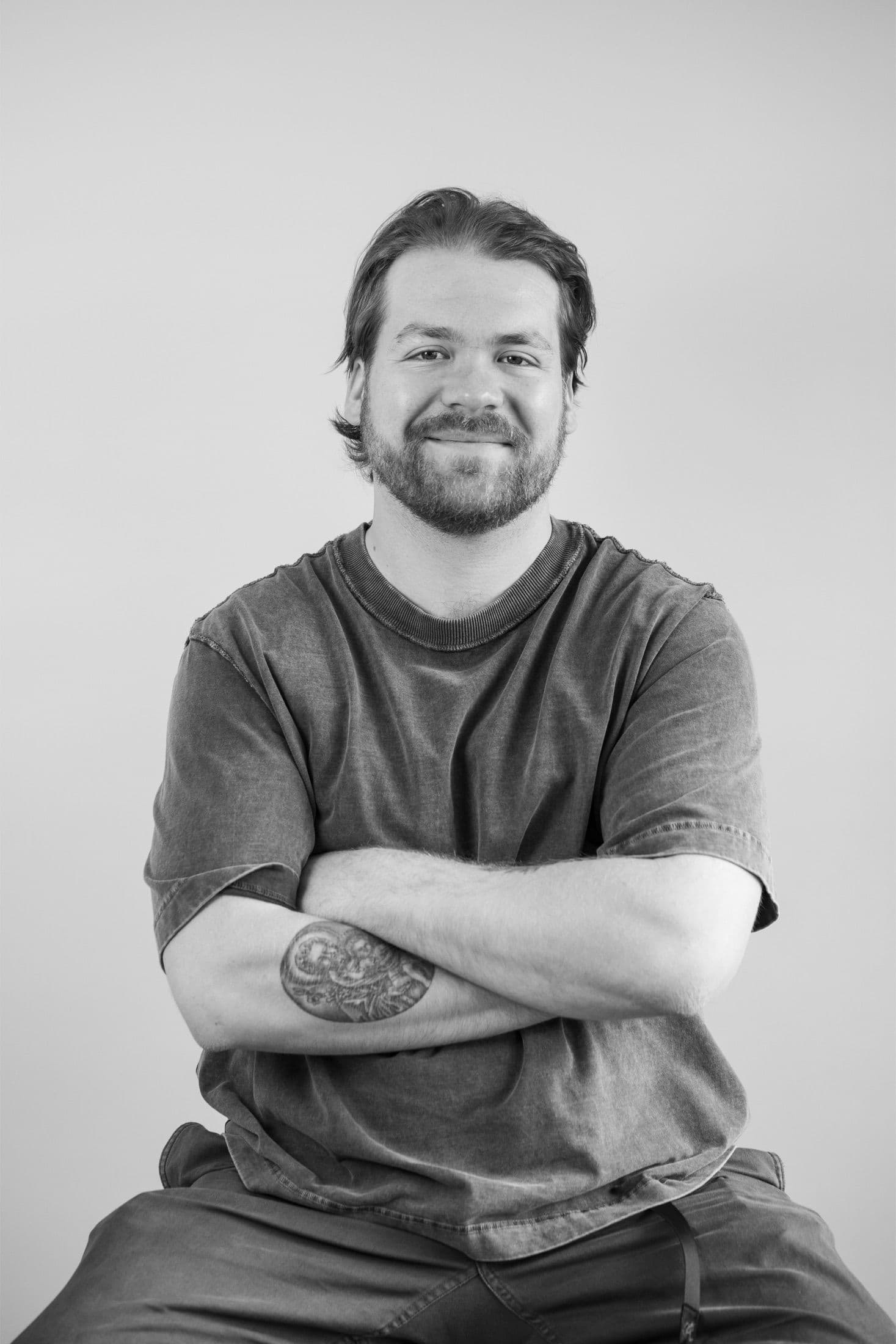 Max Tagesen seated against a light background.